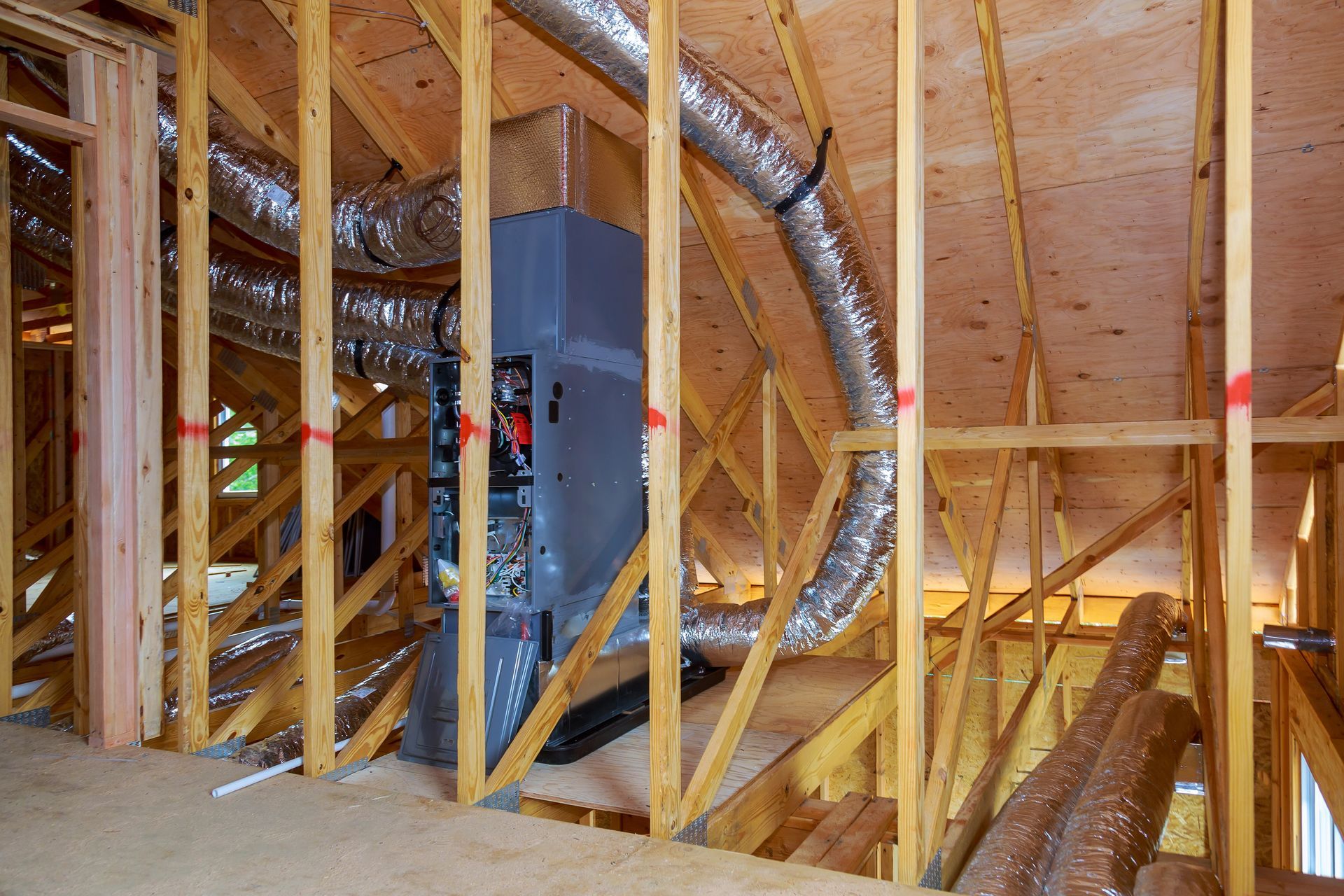 A house is being built with a heating system in the attic.