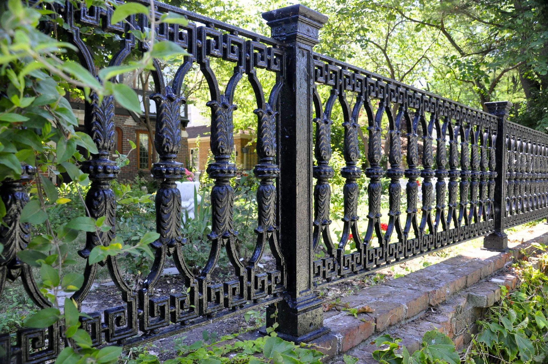 Close-up of a sturdy black chain-link fence creating a protective boundary.