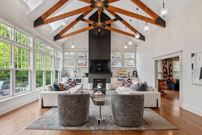 A living room filled with furniture and a fireplace.