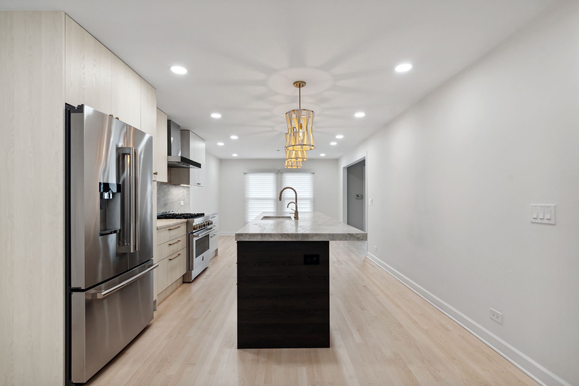 There is a large island in the middle of the kitchen.