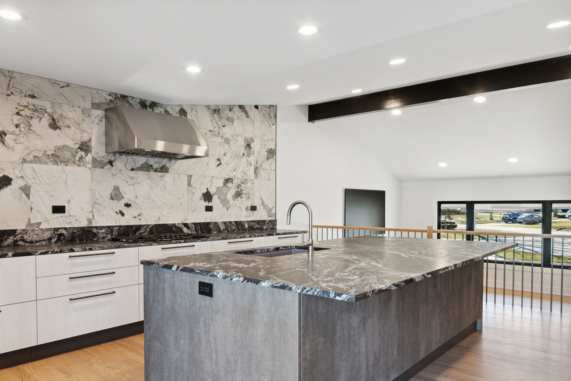 A kitchen with a large island in the middle of it