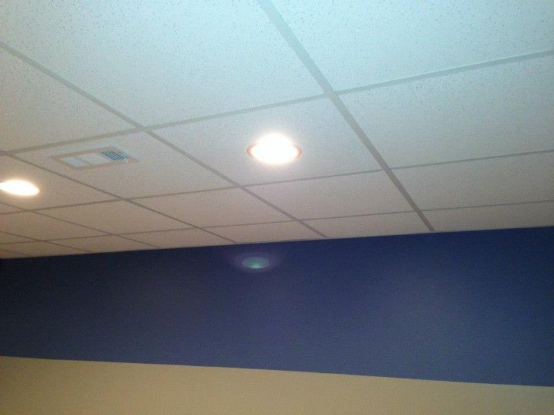 A room with a white ceiling and blue walls
