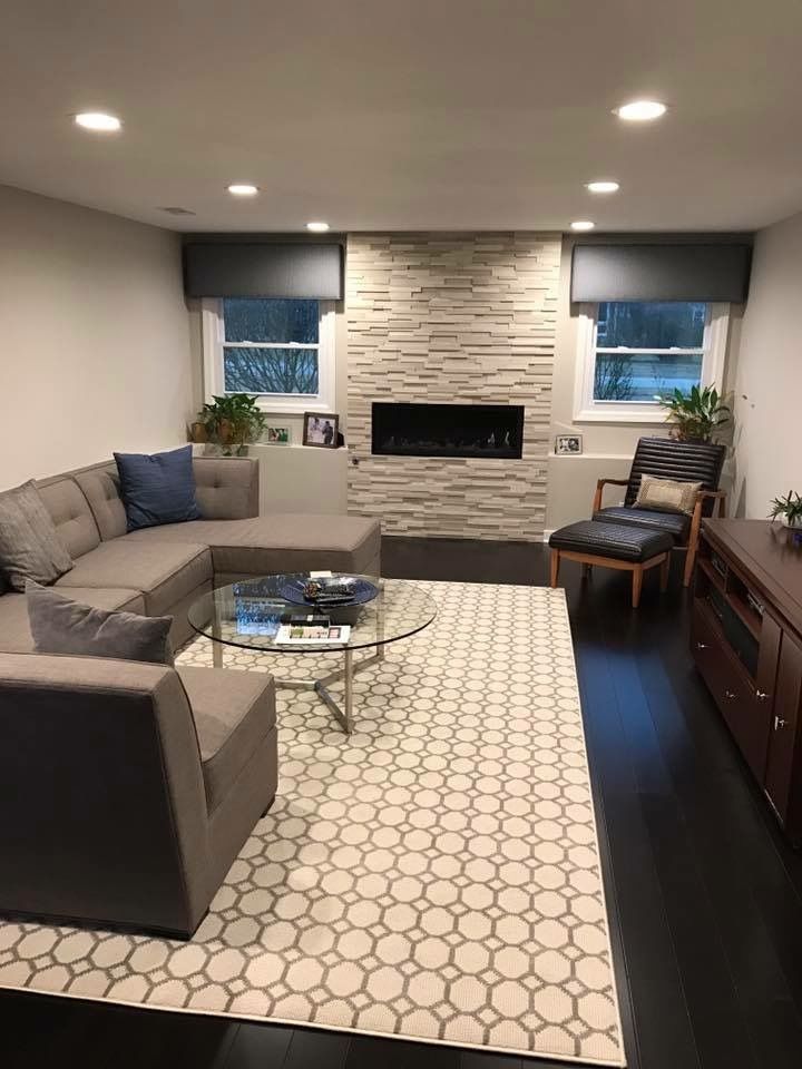 A living room filled with furniture and a fireplace.