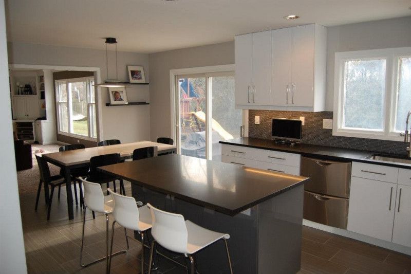 A kitchen with stainless steel appliances and a large island
