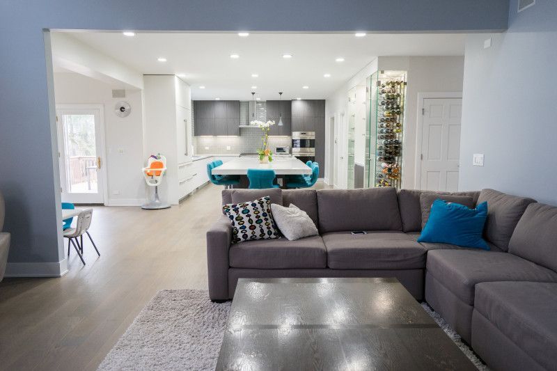 A living room with a large sectional couch and a coffee table.
