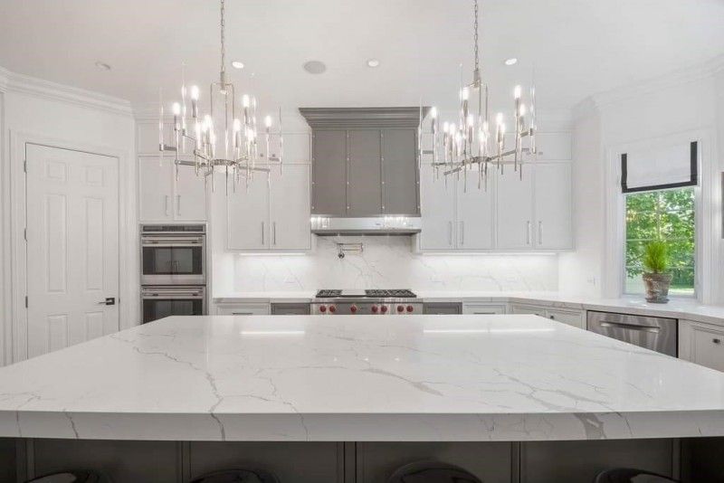 There is a large island in the middle of the kitchen.