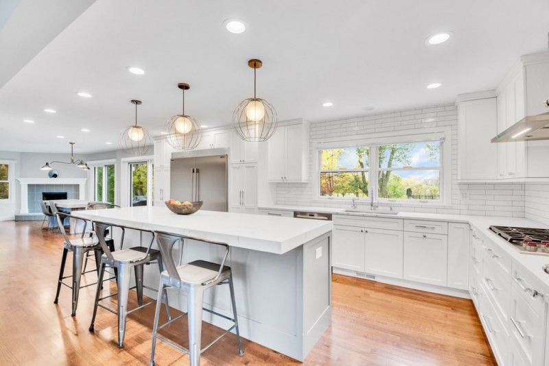 There is a large island in the middle of the kitchen.
