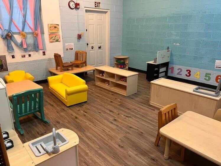 A room with a lot of furniture and a sink in it.