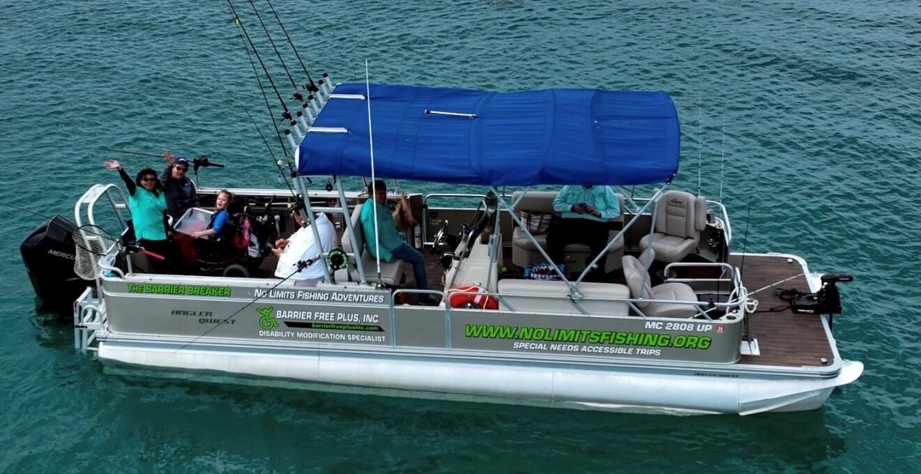 A pontoon boat with a blue canopy is floating on top of a body of water.