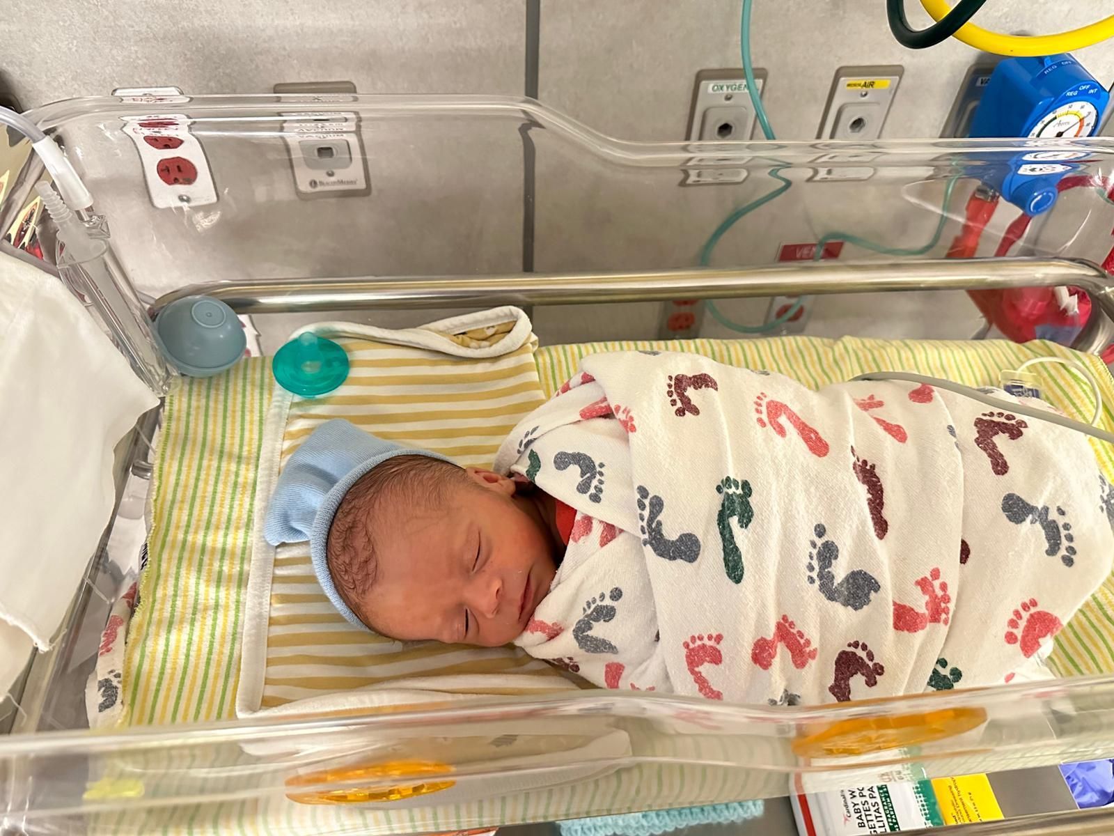 Newborn baby resting in hospital bassinet after delivery with Doula support in Abilene Texas