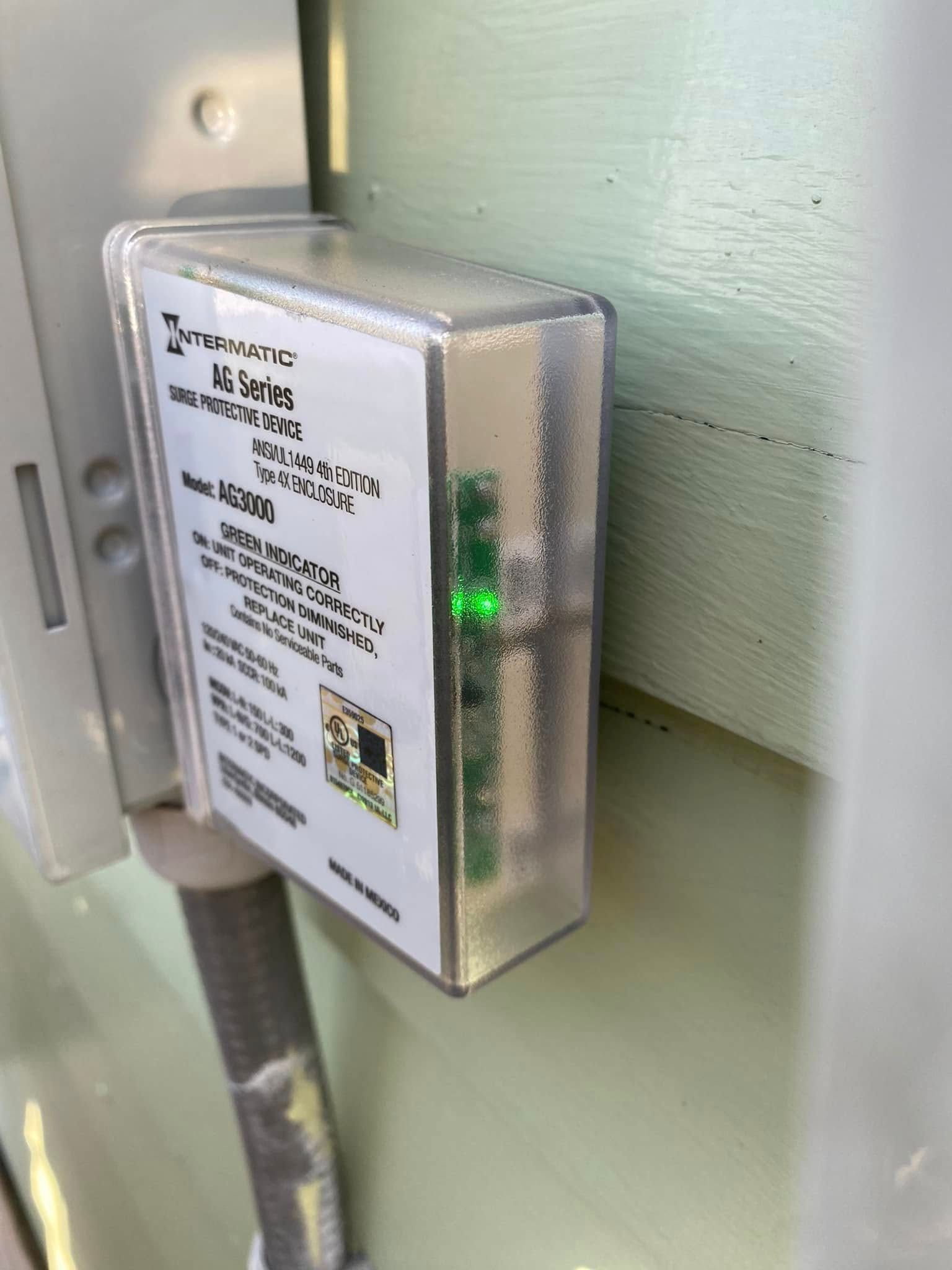 A man wearing a mask is carrying a cardboard box into a van.