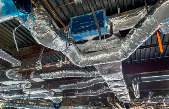 A man is loading boxes into the back of a van.