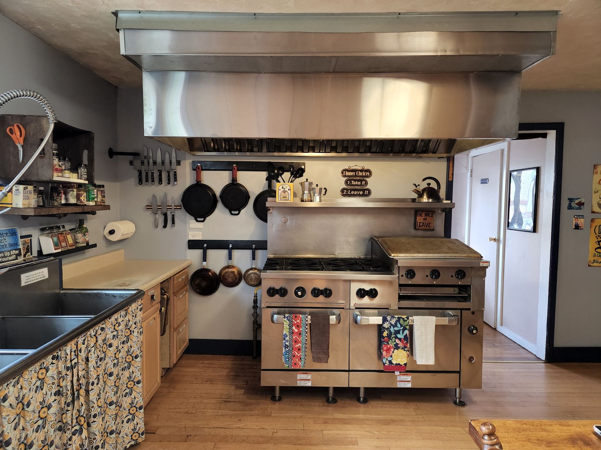 A kitchen with stainless steel appliances and a sink