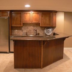 Finished basement with sink and bar