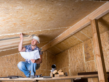 Man inspecting crawlspace so it can be encapsulated