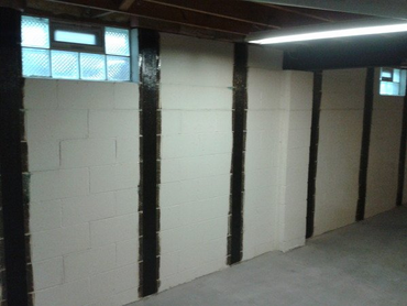 Wall with fixed foundation in basement
