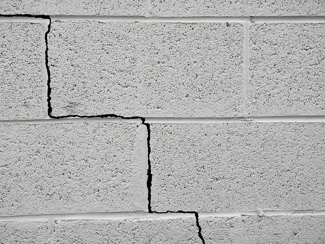 image of a foundation wall repair in Akron OH with a crack along the wall blocks