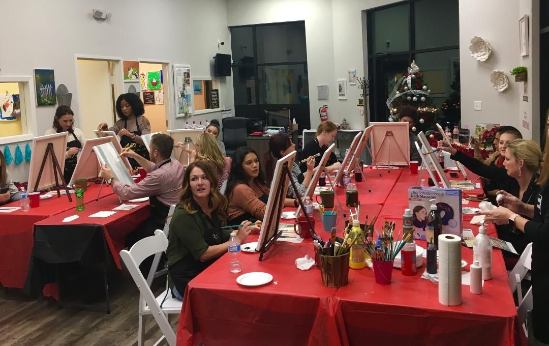 adults painting during art class