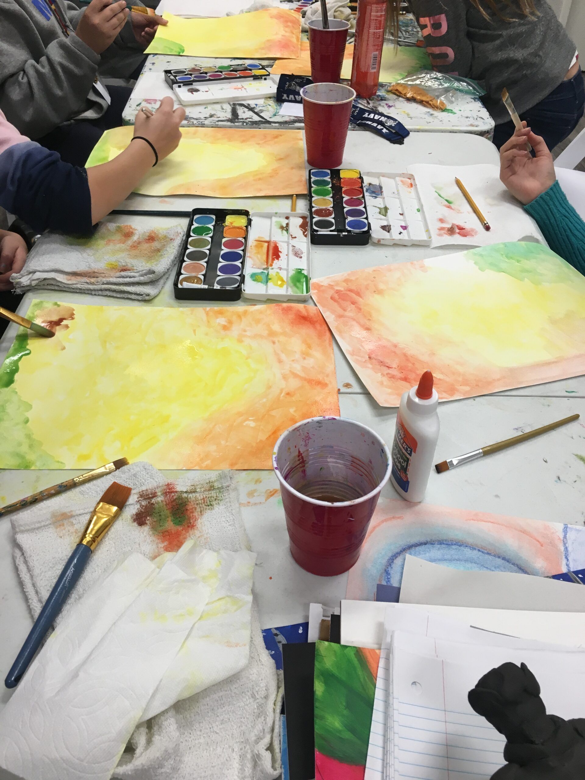 table full of art supplies during art class