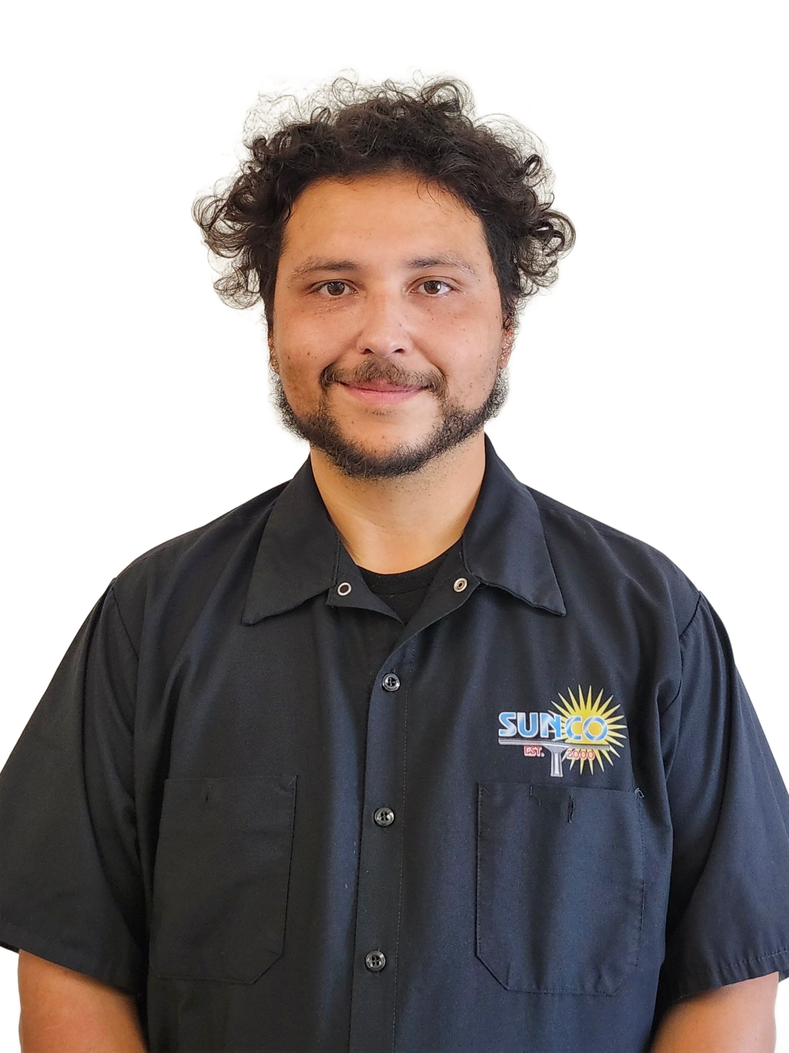 A woman with long hair is wearing a black sweatshirt and smiling.