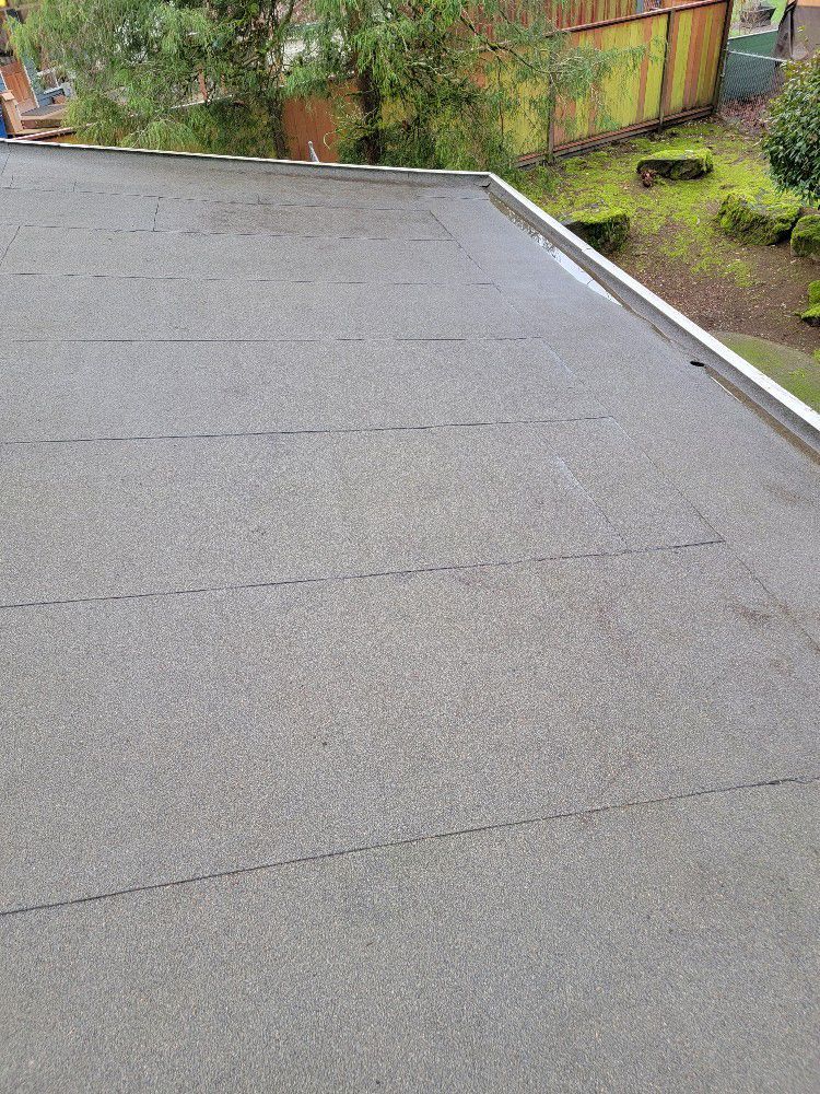 A close up of a roof with a gutter on it.