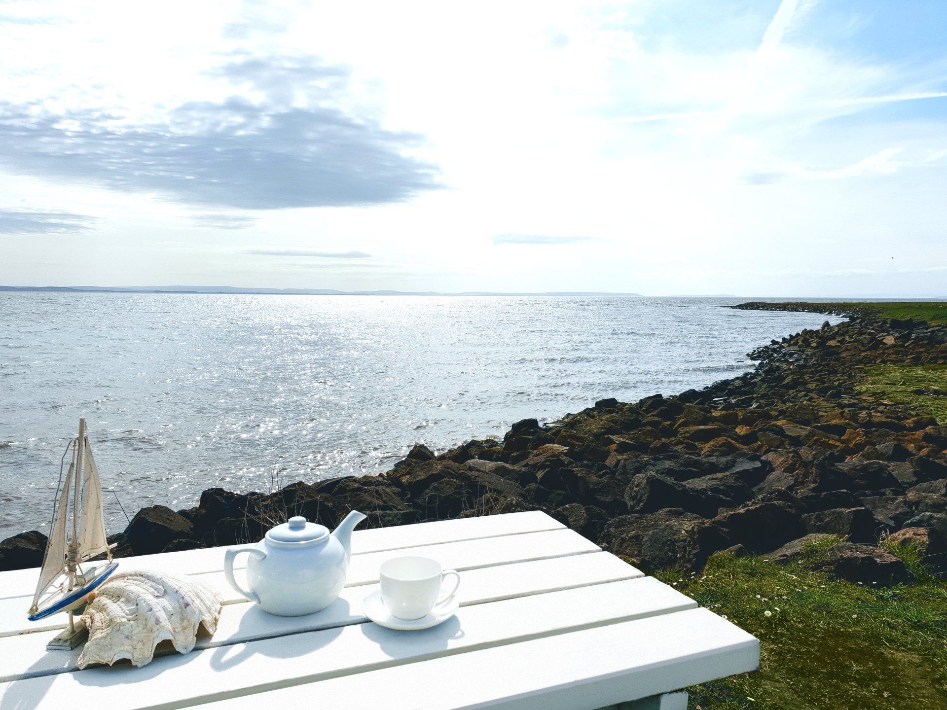 Tea on the sea wall at a bench overlooking the water at the West Usk Lighthouse.