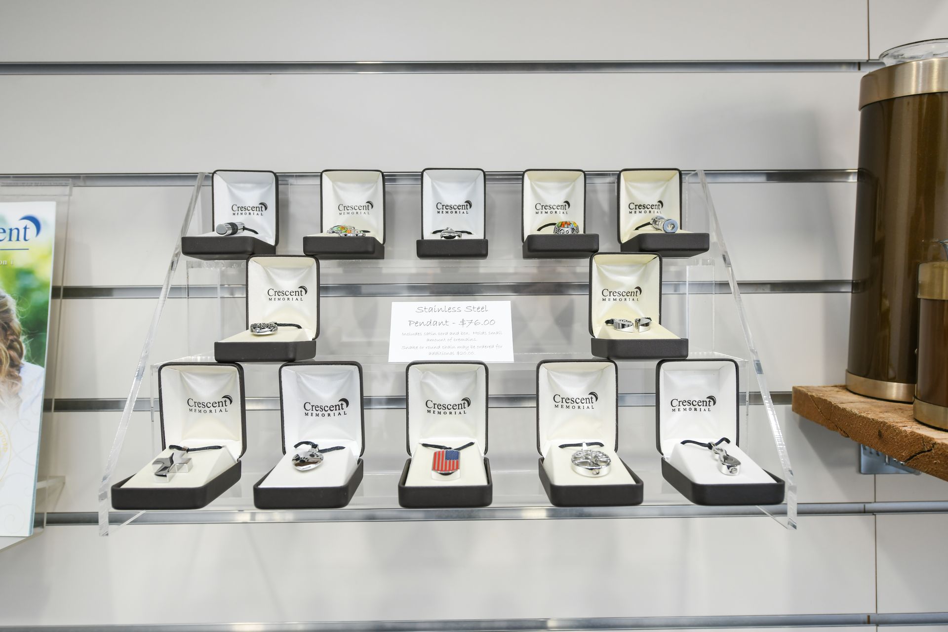 A display of cufflinks and rings on a shelf in a store.