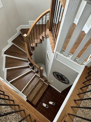 An aerial view of a spiral staircase in a house