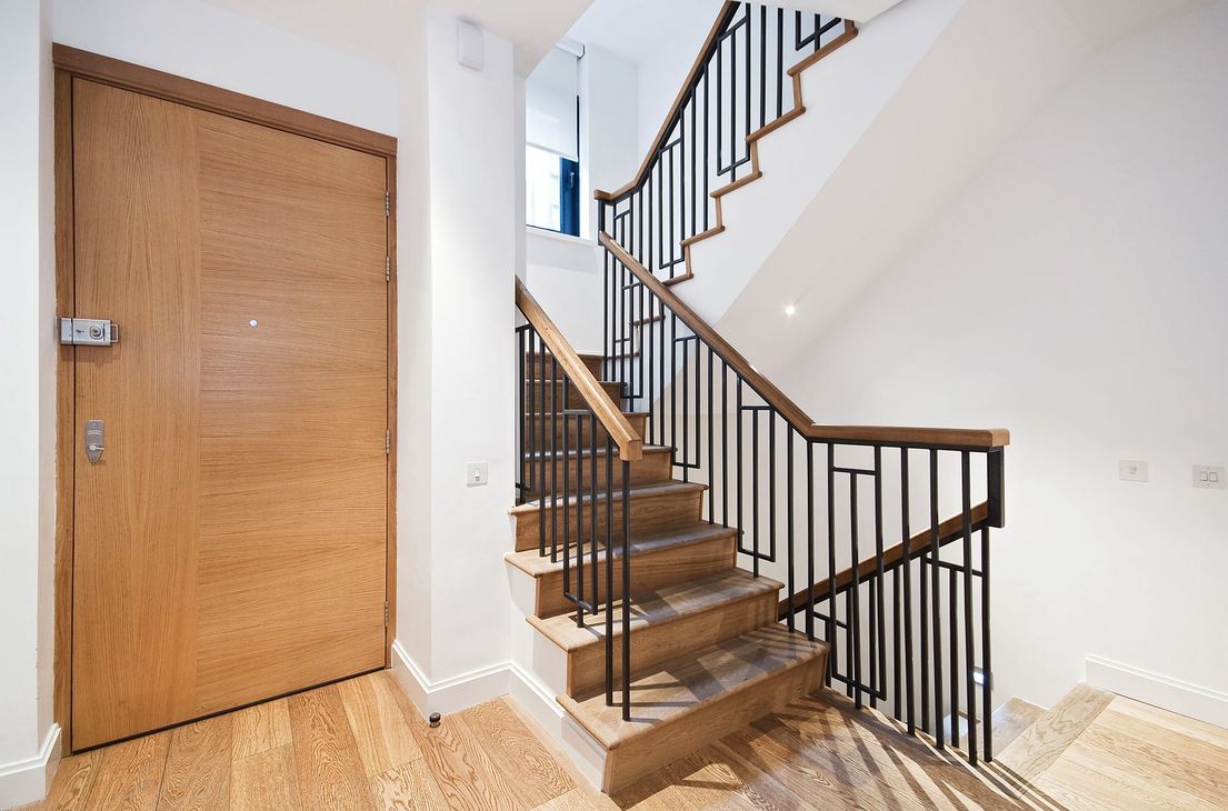Residential Wooden Staircase With Metal Railings
