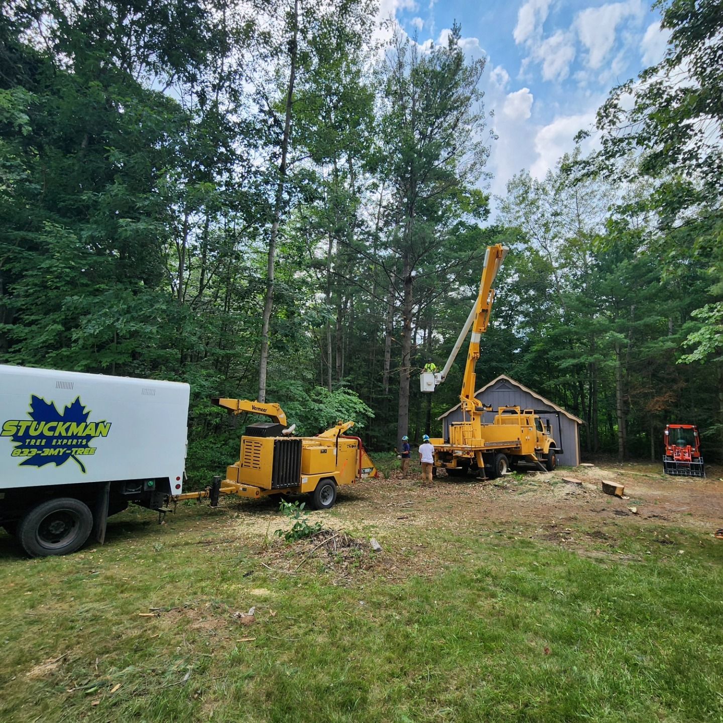 A truck with the word truckman on it is parked in a yard - Gaylord, MI - Stuckman Tree Service