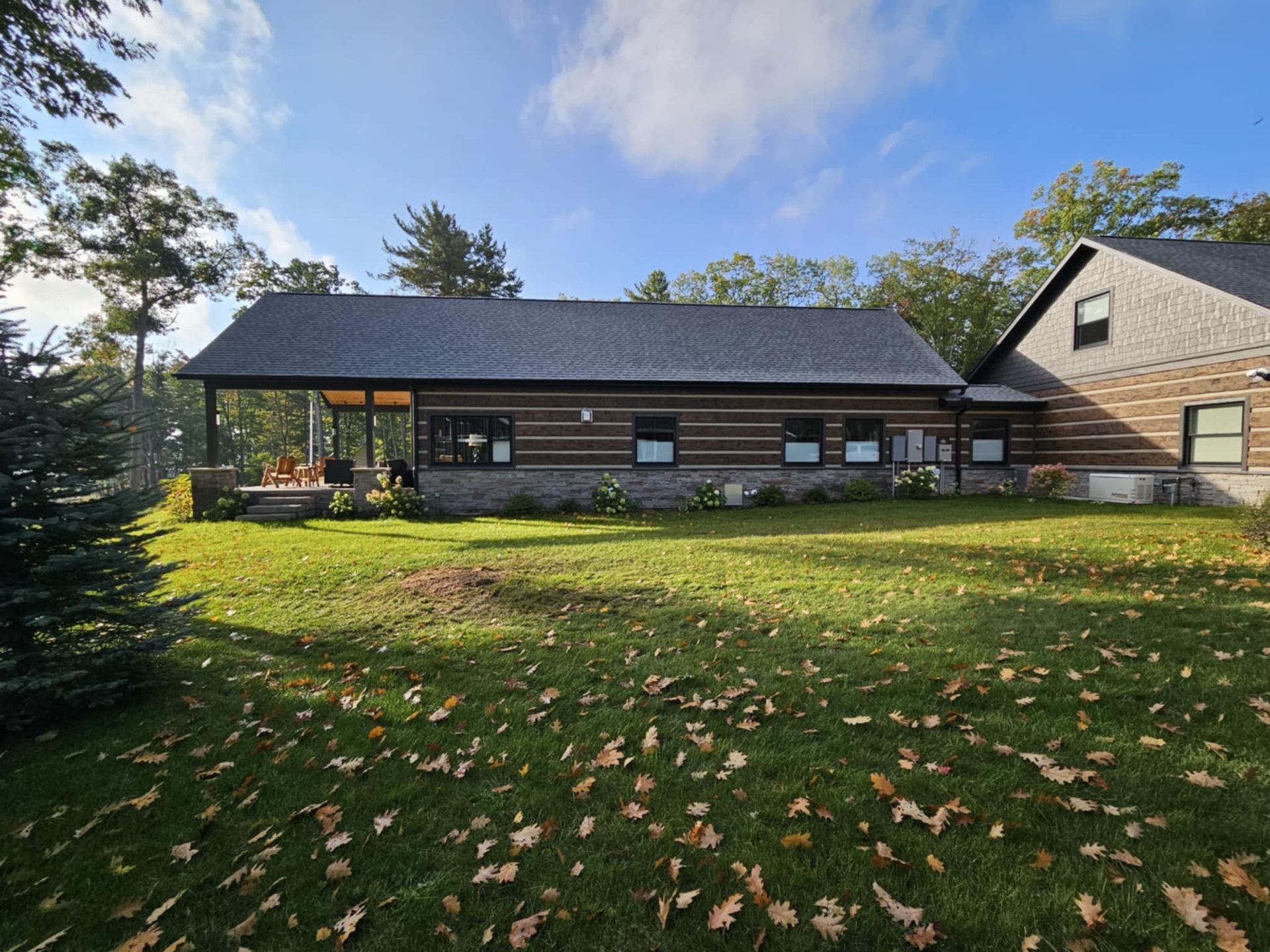 A large house with a large lawn in front of it