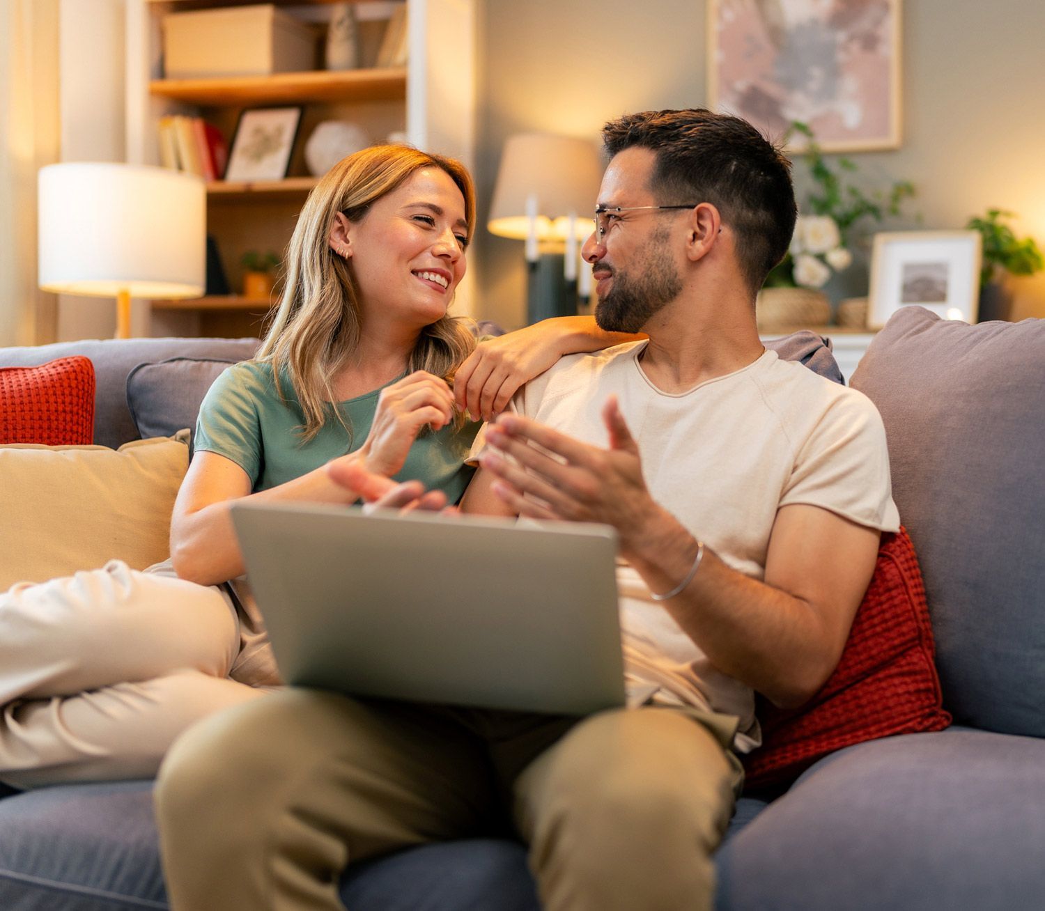 Happy Couple Checking their Laptop — Dallas, TX — Wings of the Future