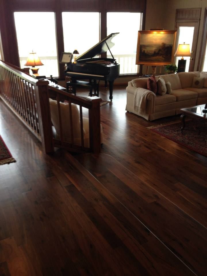 A living room with a piano and a couch
