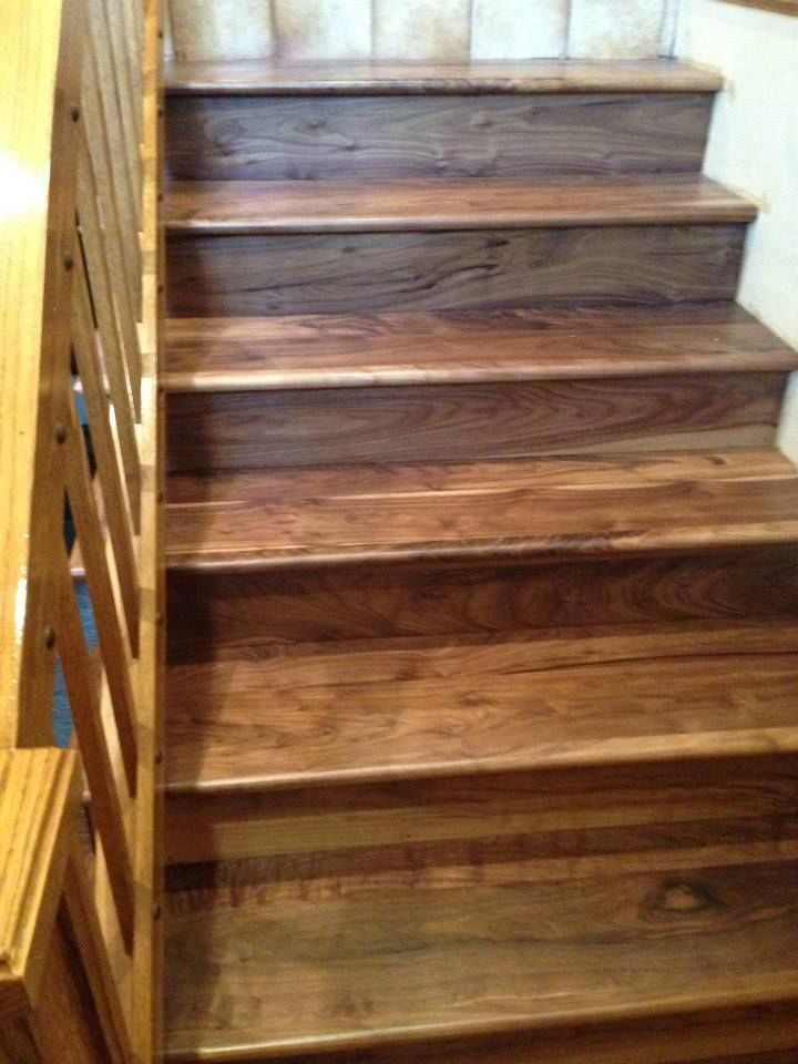 The stairs are made of wood and have a wooden railing.