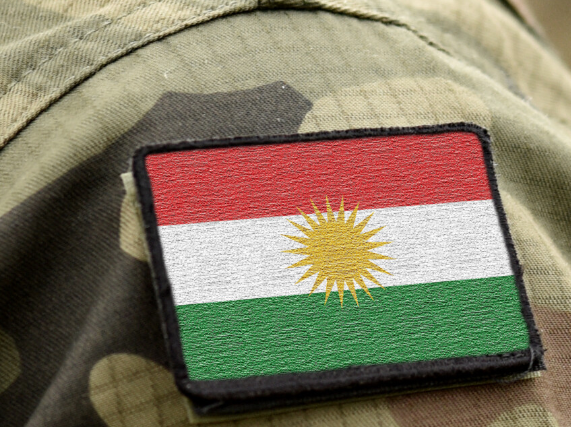 Humanitarian Programs in Iraq: A patch with the kurdish flag on a soldier 's uniform