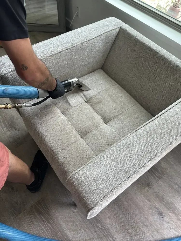 MB Carpet Cleaning- A pool table is sitting in the middle of a living room.