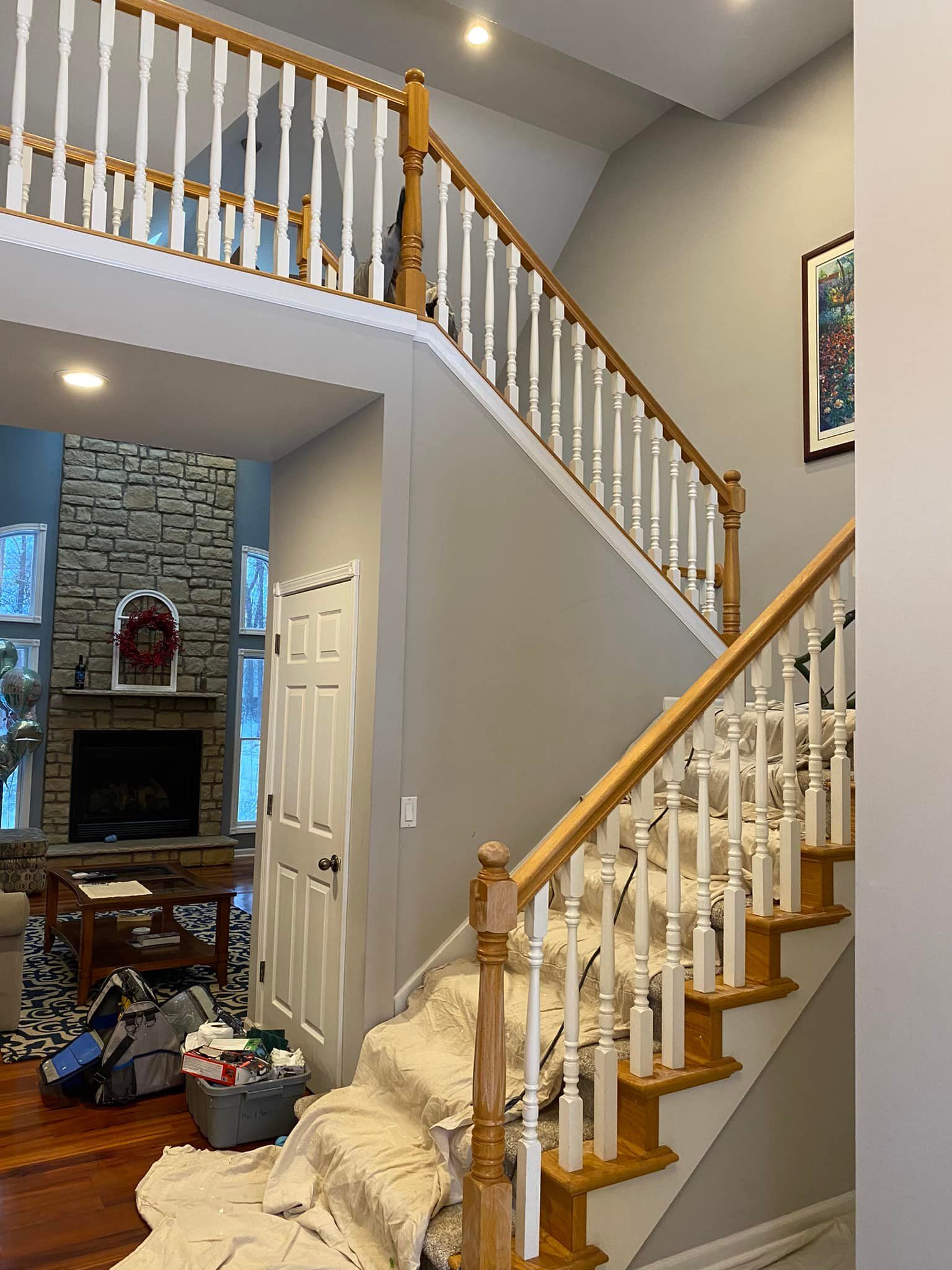 A staircase in a house with a white railing