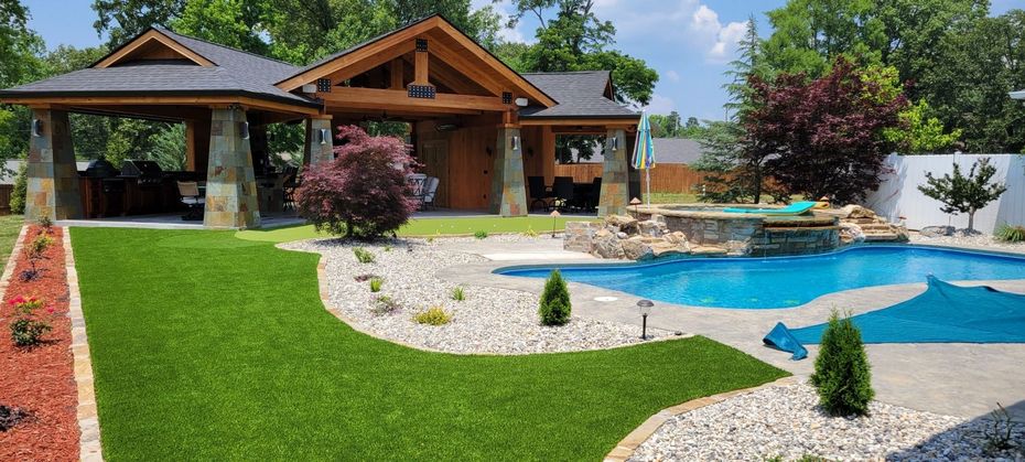 A large house with a large swimming pool in the backyard.