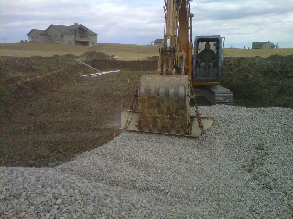 White Elite Plumbing van parked outdoors with logo.