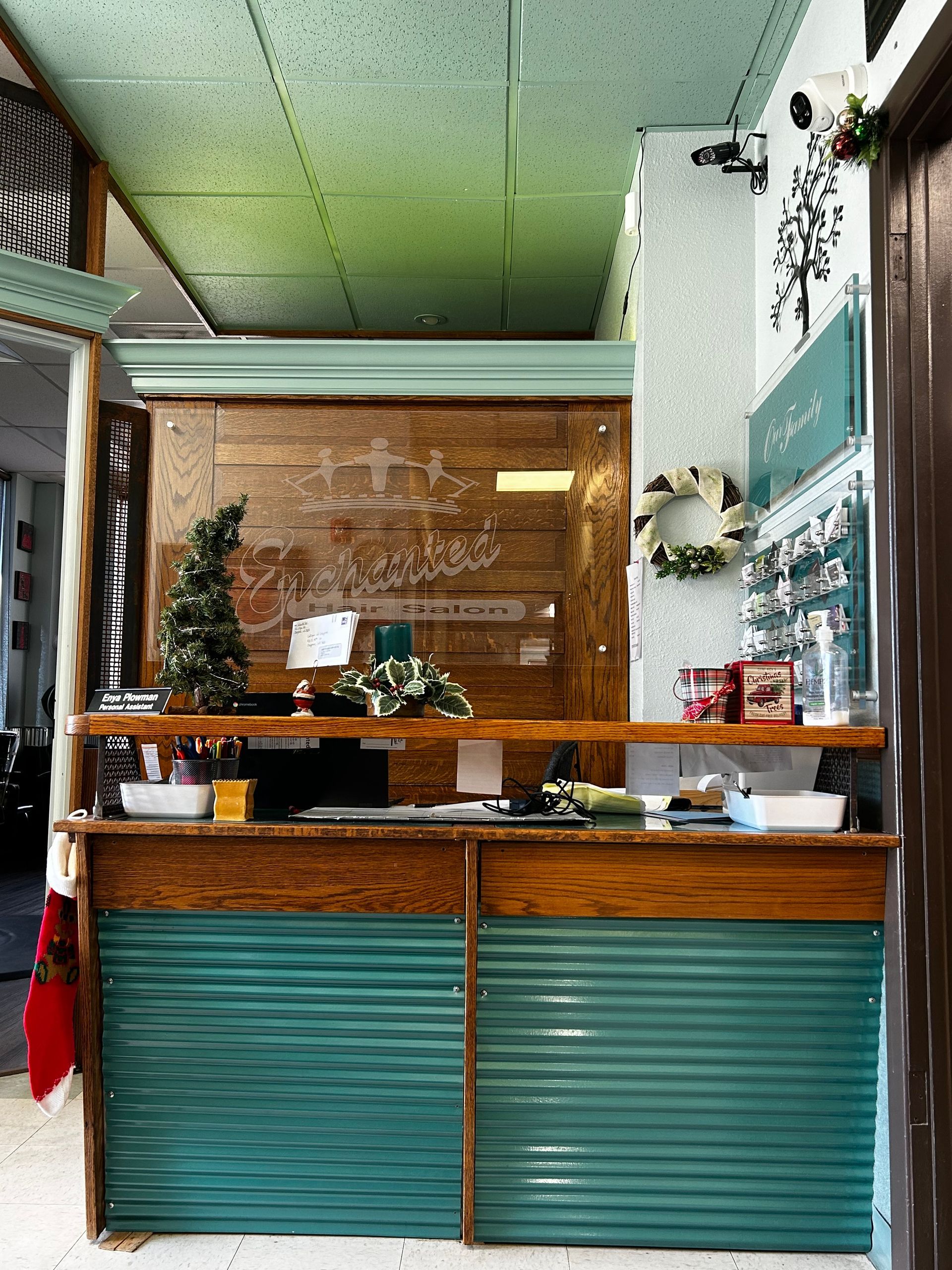 A counter in a restaurant with a christmas tree on it.