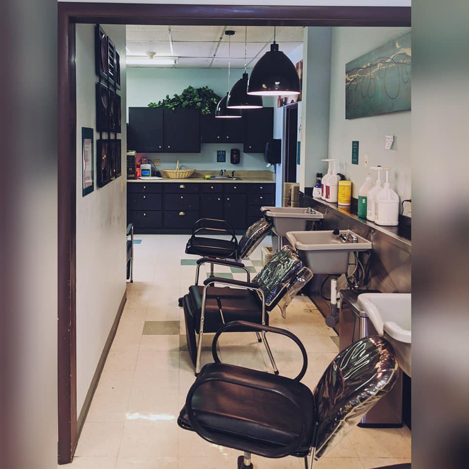 A row of chairs in a room with a sink