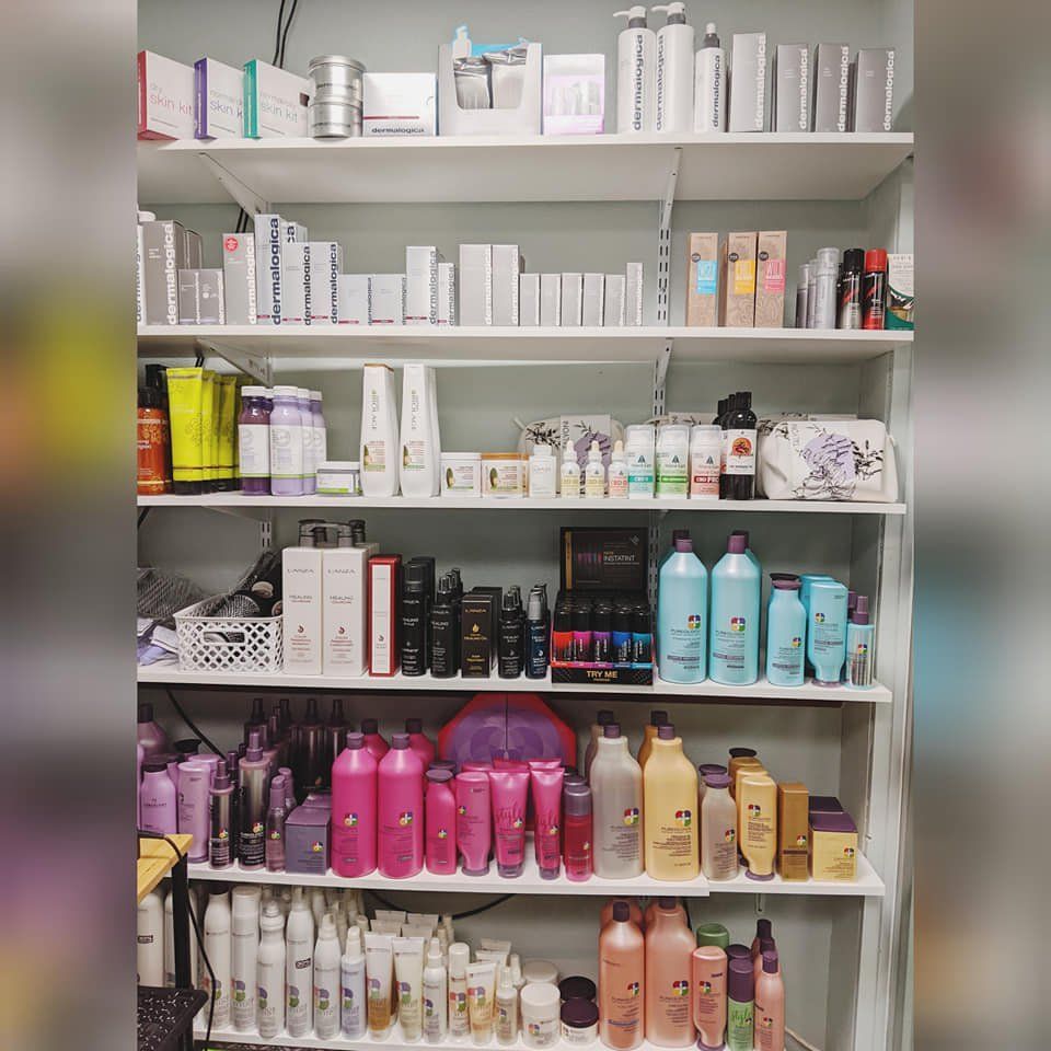 A room filled with shelves filled with lots of hair products.