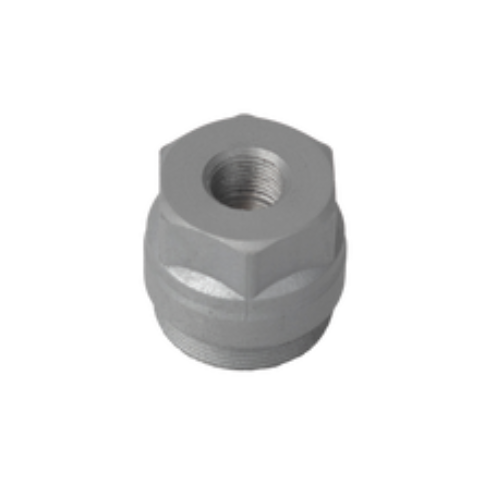 Uma porca de metal com um furo no meio em um fundo branco.