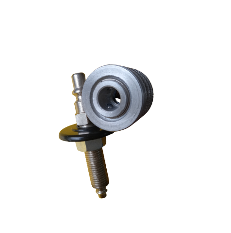 Um close de um objeto de metal com um furo no meio em um fundo branco.