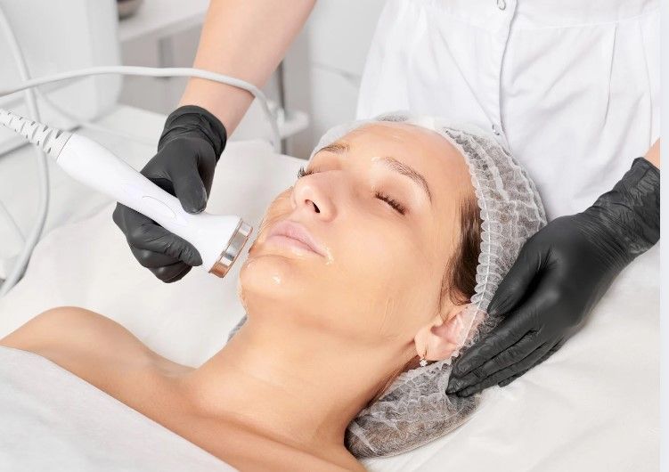 The Skinutrition Clinic performing plasma skin tightening around the chin of a client in Coventry