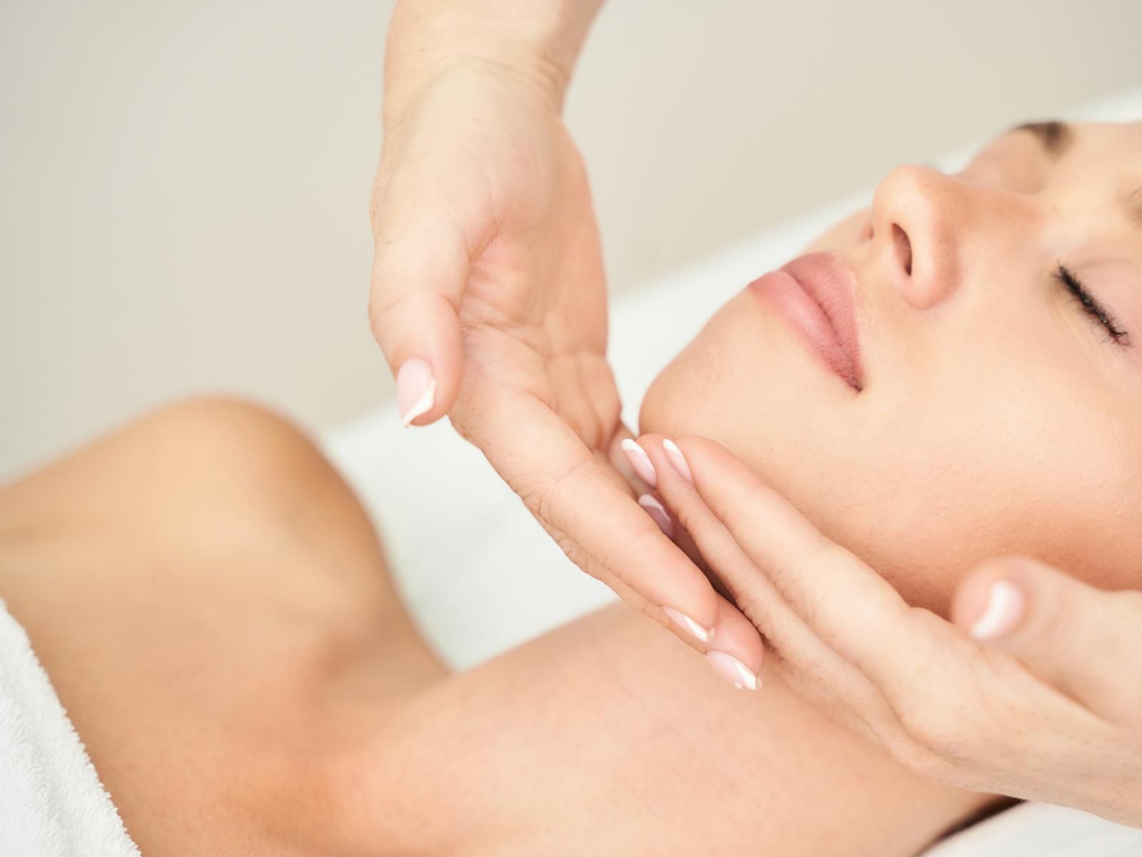 The Skinutrition Clinic applying a skin treatment to a client's face 