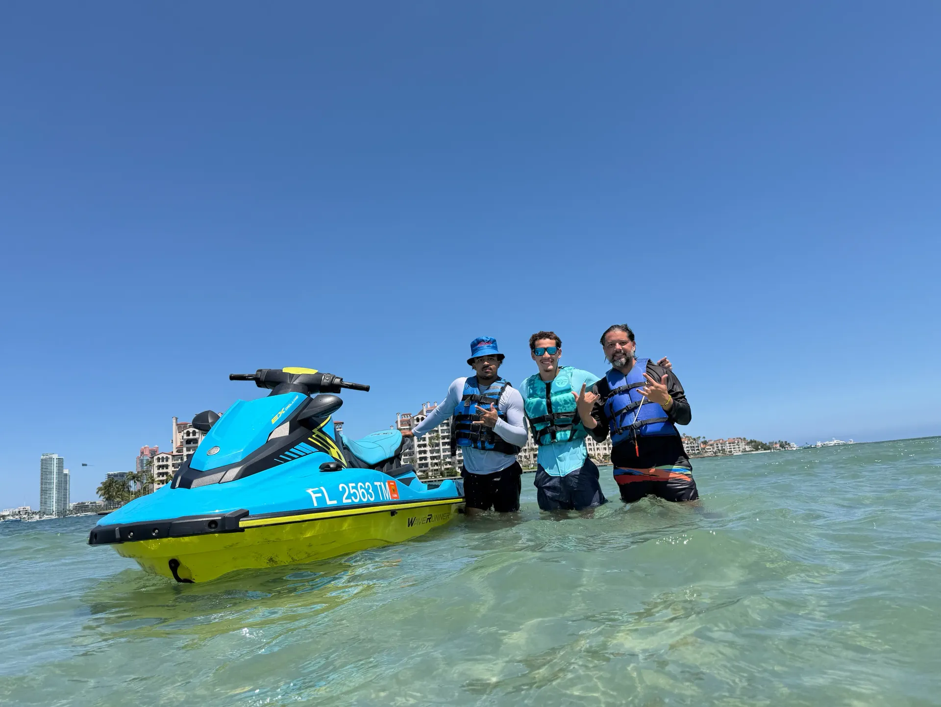 Guests enjoying Bayside Jet Ski Tours at the Biscayne Bay sandbar near Fisher Island