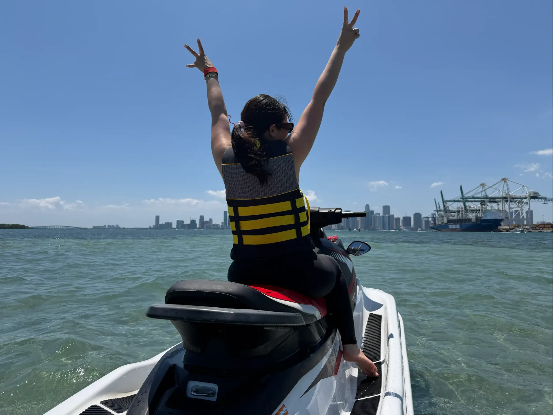 Guest enjoying Downtown Miami Jet Ski Rentals with skyline views across Biscayne Bay