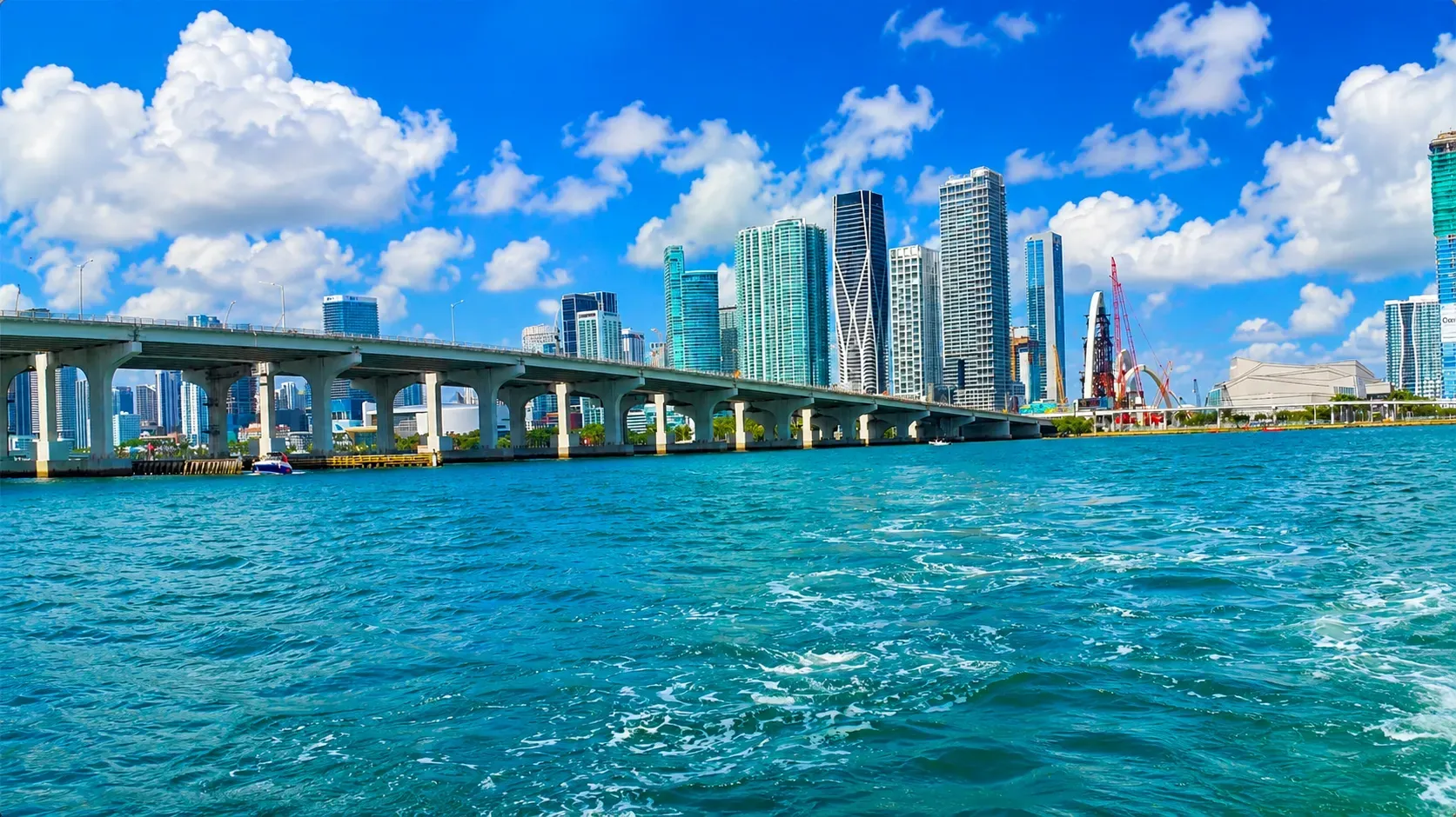 Downtown skyline of Miami viewed from Biscayne Bay with the MacArthur Causeway crossing the waterfront