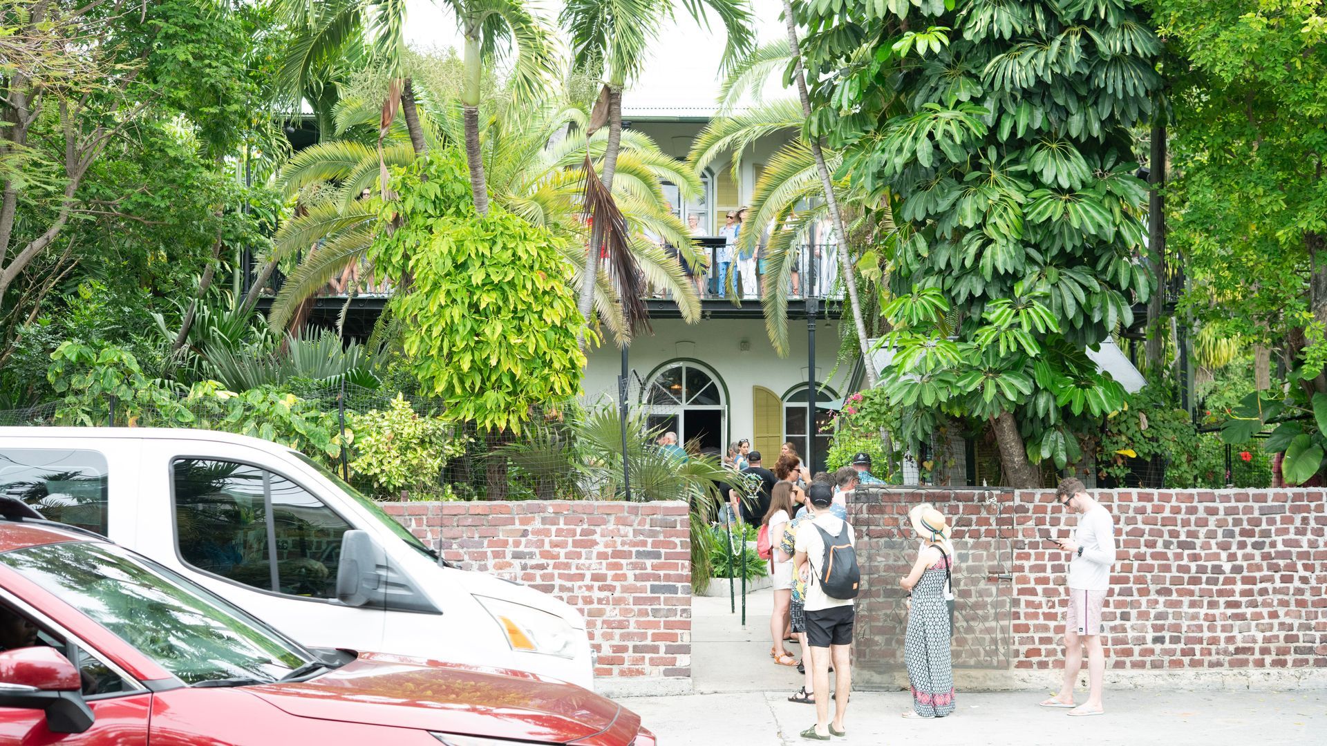 Visitors lined up outside the Ernest Hemingway House in Key West during the Miami to Key West round-trip bus tour